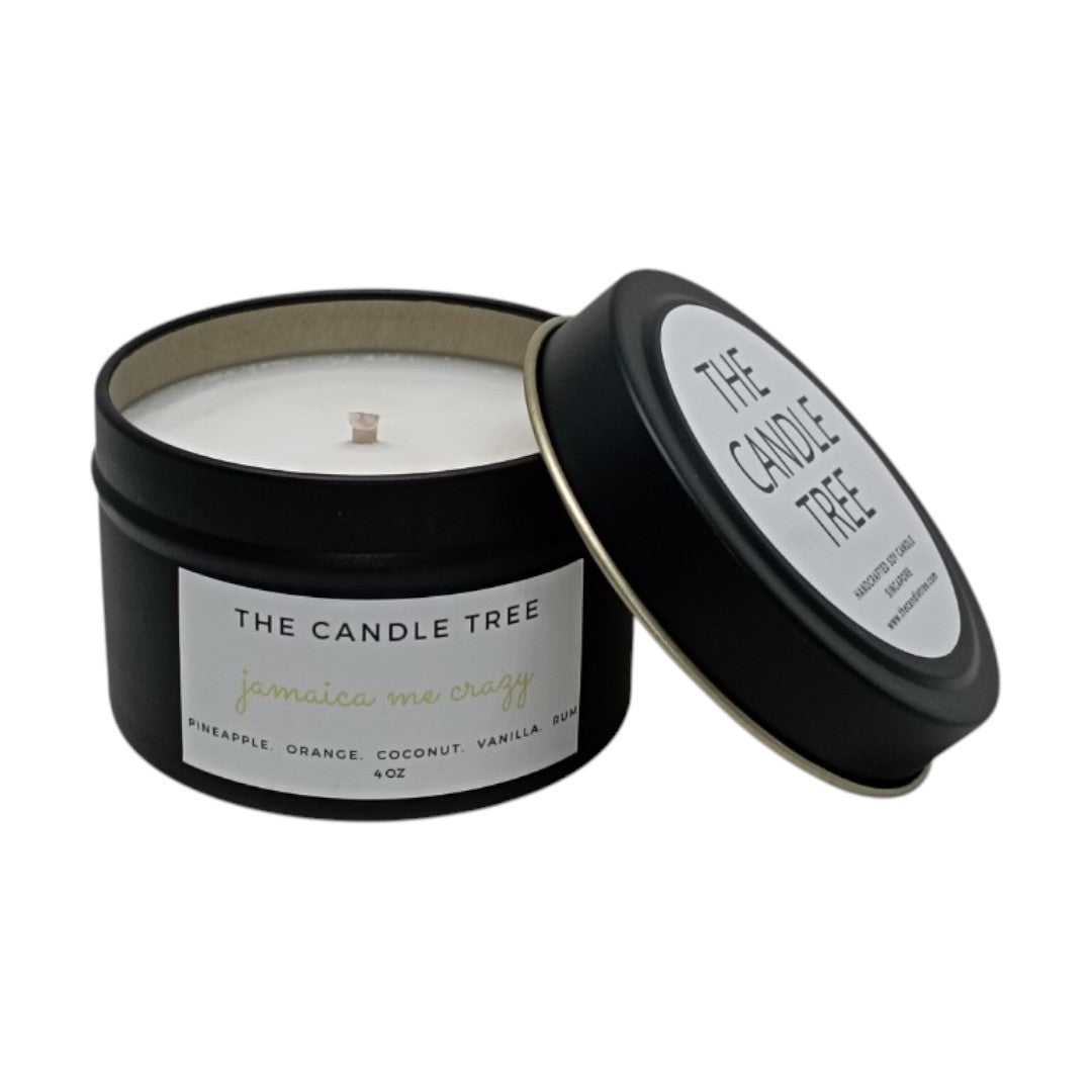 Candle in a black container with 'The Candle Tree' label on a white background, scented 'Jamaica Me Crazy'. Size 4oz