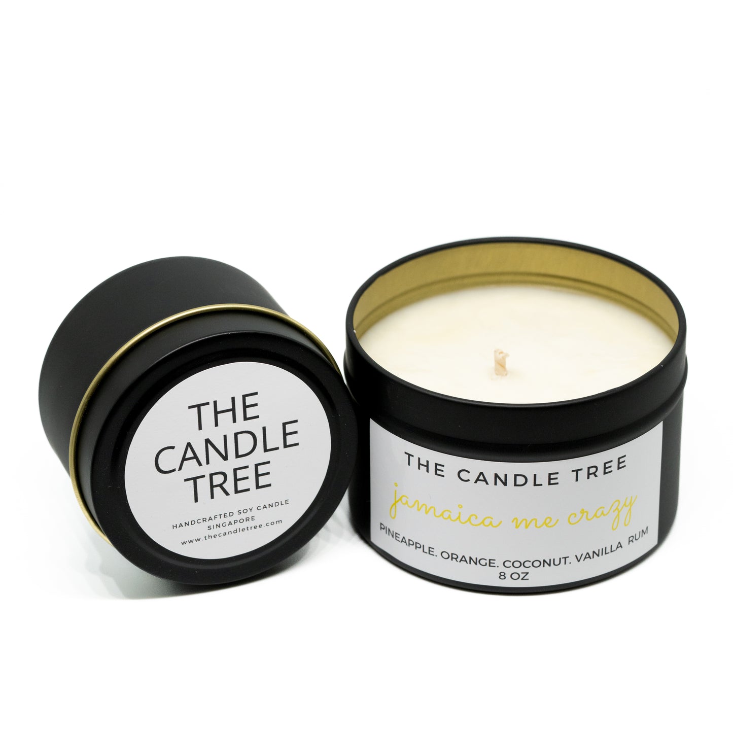 Candle in a black container with 'The Candle Tree' label on a white background. Scented with 'Jamaica Me Crazy'. Sizes 4 and 8 oz